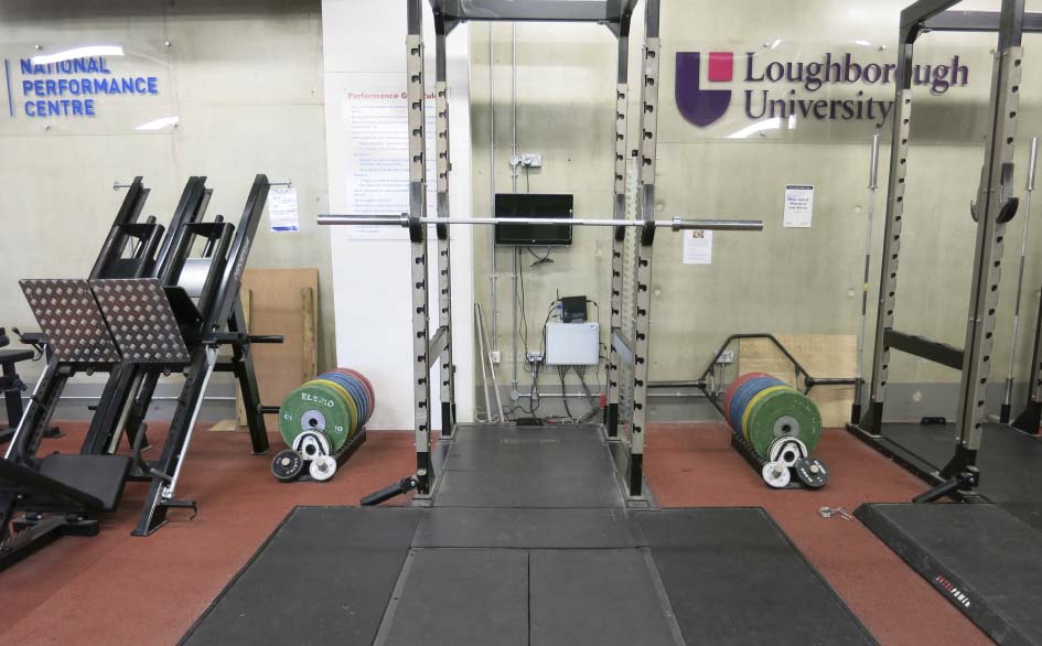 photograph of squat rack and weights